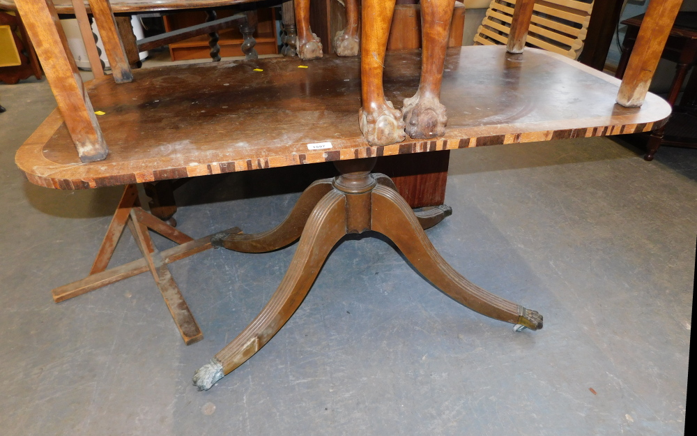 A mahogany coffee table, with boxwood border on striped outsplayed legs, terminating in claw and cas