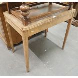 An oak leatherette inset top side table.