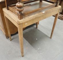 An oak leatherette inset top side table.