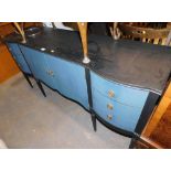A painted sideboard, in two tone blue, with two cupboard doors flanked by three drawers to each side