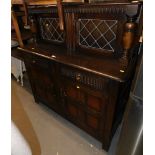 An Old Charm style oak dresser, with two glazed top above arrangement of two drawers and two cupboar
