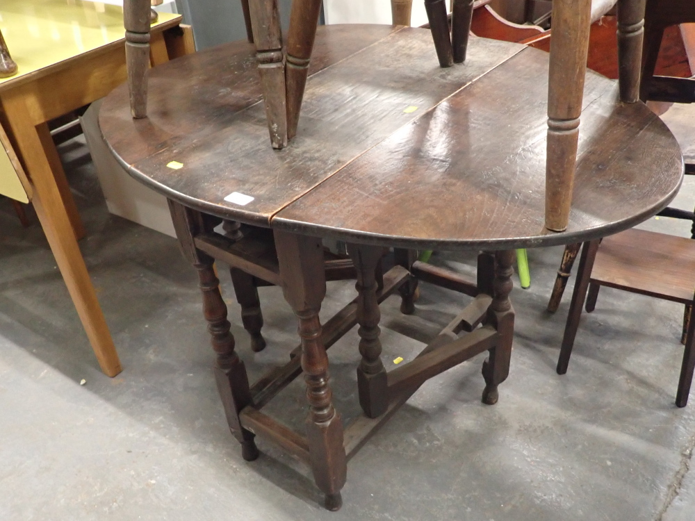 A 19thC oak drop leaf table.