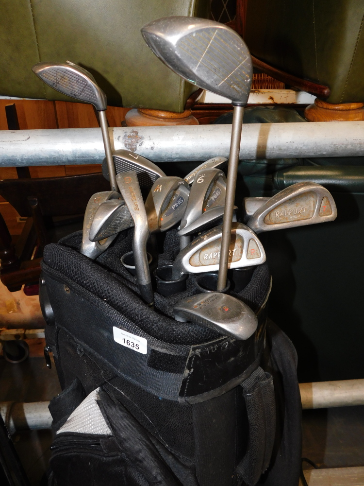 A Powakaddy soft shell golf carry bag and collection of Report, Ben Sayers and Ping golf clubs. Buy