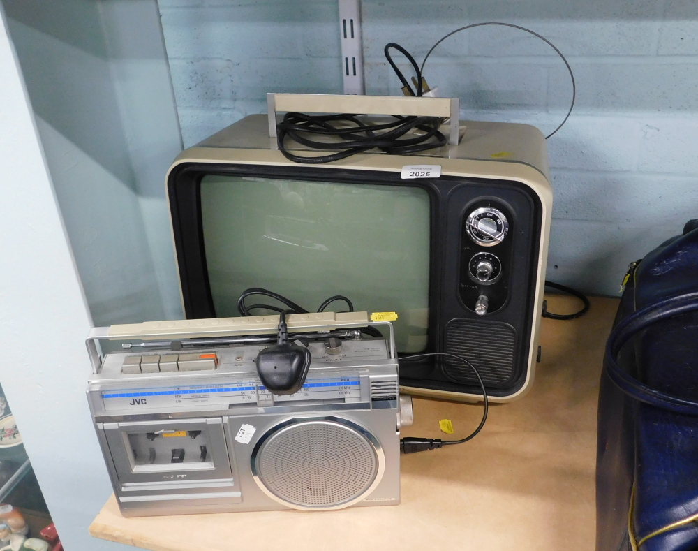 A Solid State vintage television, together with a JVC cassette player.