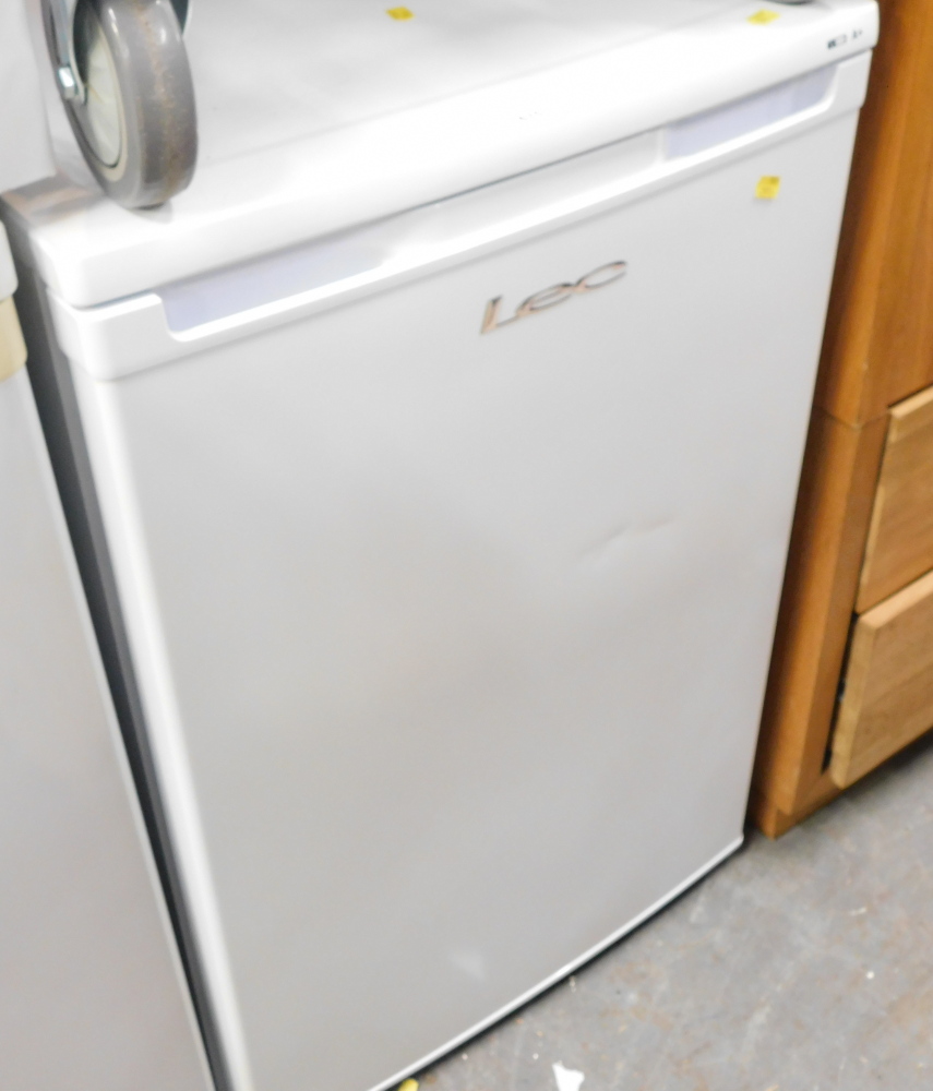 A Lec white finish under counter freezer.