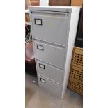 A four drawer metal filing cabinet, with key.