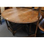 A 19thC oak drop leaf table and an easel. (2)