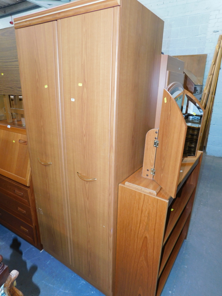 A group of beech effect bedroom furniture, comprising a five drawer chest, two bedsides, bookcase, d - Image 2 of 2