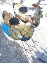 Two painted metal cockerel garden planters. Buyer Note: VAT payable on the hammer price of this lot