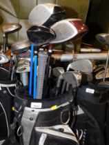 A TaylorMade soft shell golf caddy and various clubs, to include Wilson and Dunlop. Buyer Note: VAT