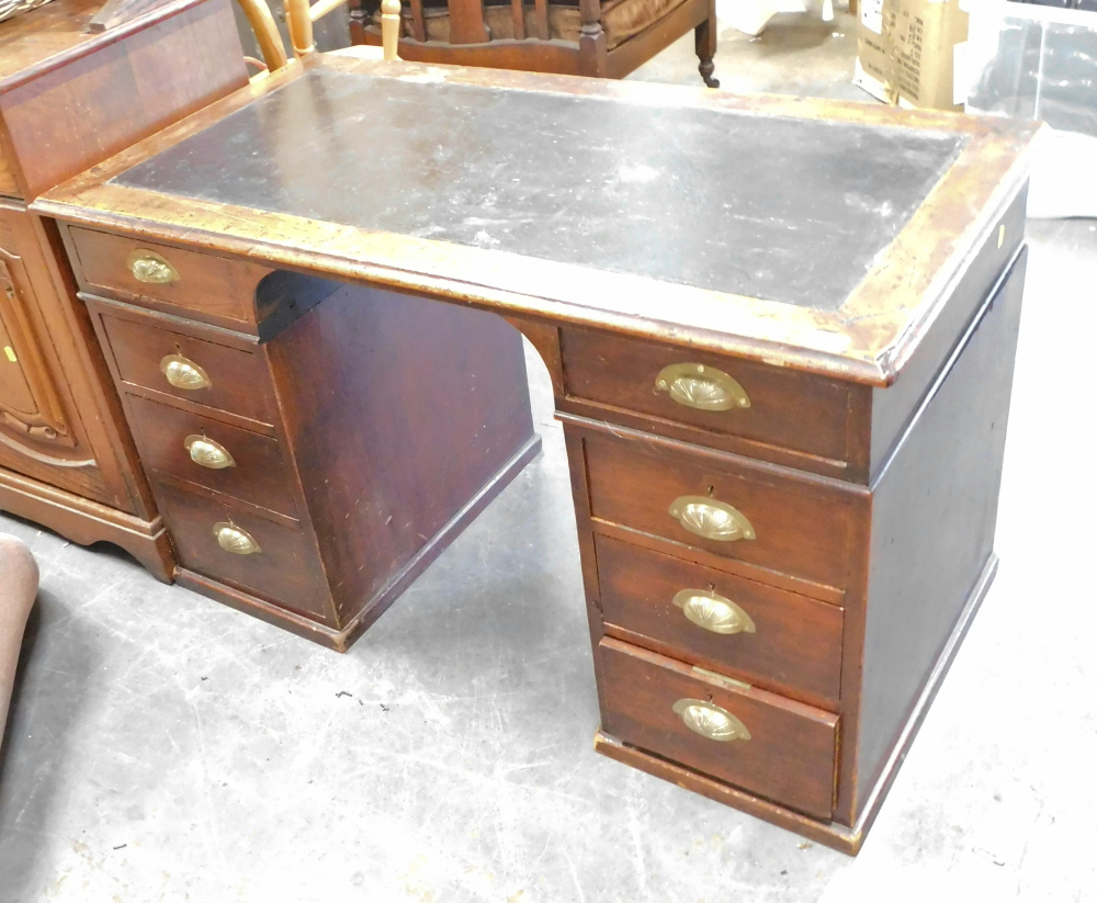A mid 20thC mahogany pedestal desk, with leather inset top, on two legs, each set with three drawers