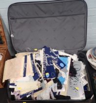 A quantity of lace, differing colours, designs, etc., contained in a canvas suitcase.
