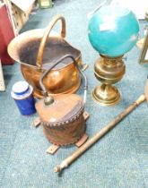 A copper helmet shaped coal scuttle, together with a brass oil lamp, fire bellows, etc.