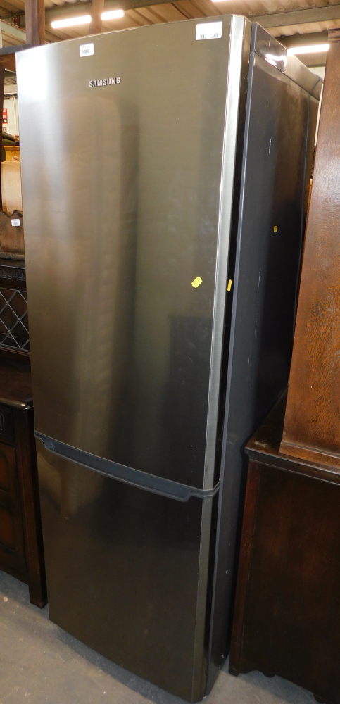 A Samsung fridge freezer, 183cm high, 59cm wide, 62cm deep.