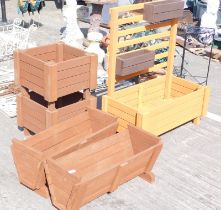 A pair of rectangular garden planters, together with two further square examples, and another.