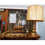 Two gilt framed wall mirrors, two 19thC footstools, and a brass table lamp with decorated shade sign