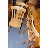 A set of five beech dining chairs.