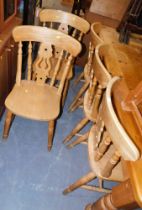 A set of five beech dining chairs.