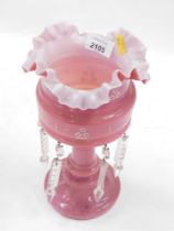 A Victorian pink milk glass lustre, with various glass droplets, 26cm high. (AF)