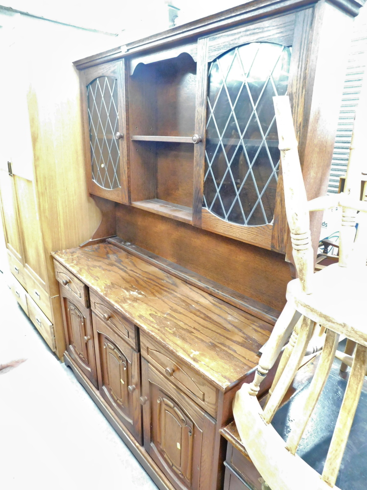 A mahogany kitchen dresser, with central bookshelf section, two glazed doors, on shelf top above thr