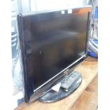 A Samsung 26" flat screen television, with remote.