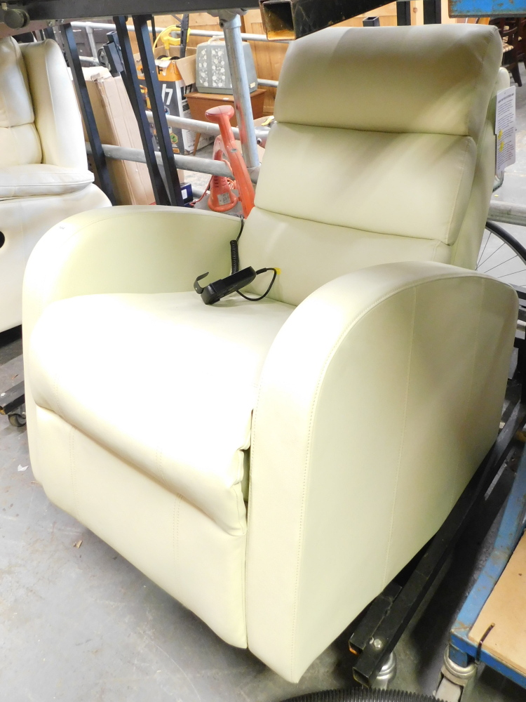 A cream leatherette electric reclining single armchair.