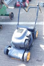 A petrol lawn mower. Buyer Note: VAT payable on the hammer price of this lot