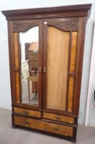 A Victorian mahogany double wardrobe, with burr walnut two single drawer and long drawer base. (AF)