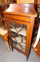 A mahogany corner display cabinet, with an arched and moulded cornice, above single astragal glazed