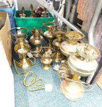 Various brass and other oil lamp bases.