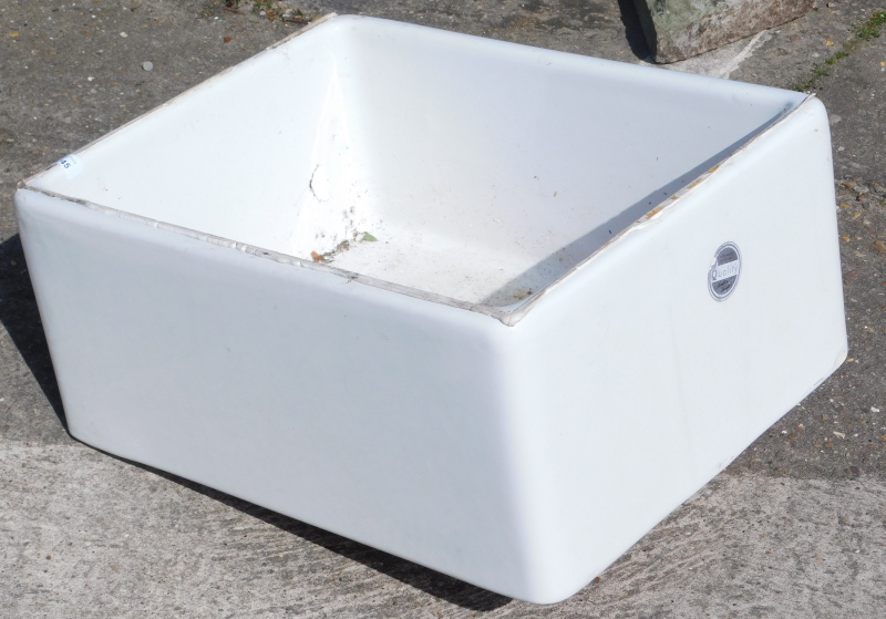 A ceramic Belfast sink, 58cm wide.