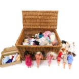 A large quantity of Barbie dolls, knitted clothing, an Action Man, and a Fortnum and Mason hamper.