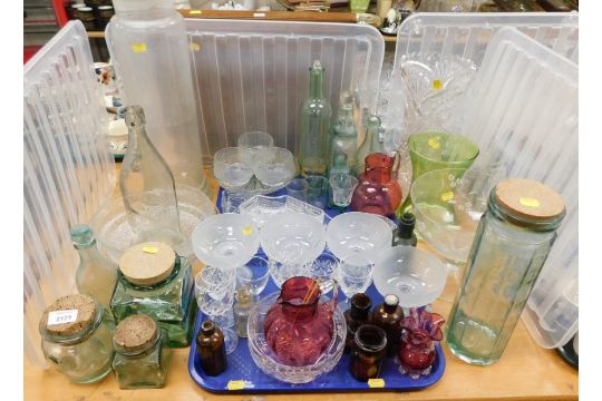 Glassware, to include cranberry glass jug, bark effect dishes, various glass bottles, cut glass vase