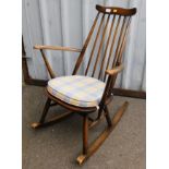 An Ercol child's rocking chair, bearing label.