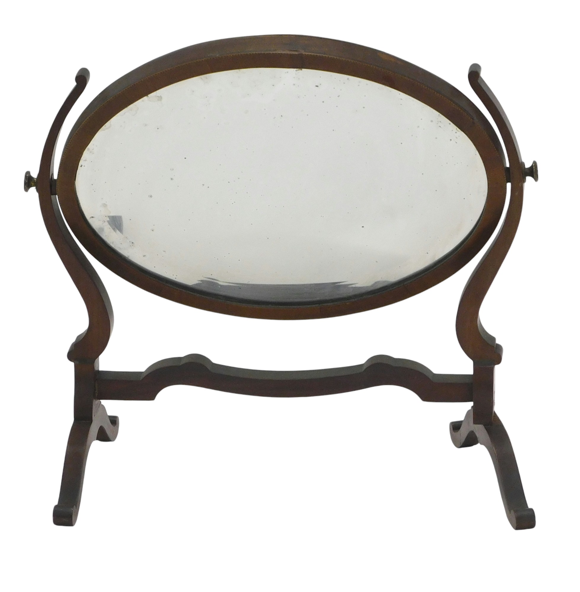 An Edwardian mahogany chequer banded oval dressing table mirror, with a bevelled mirror plate, on sp