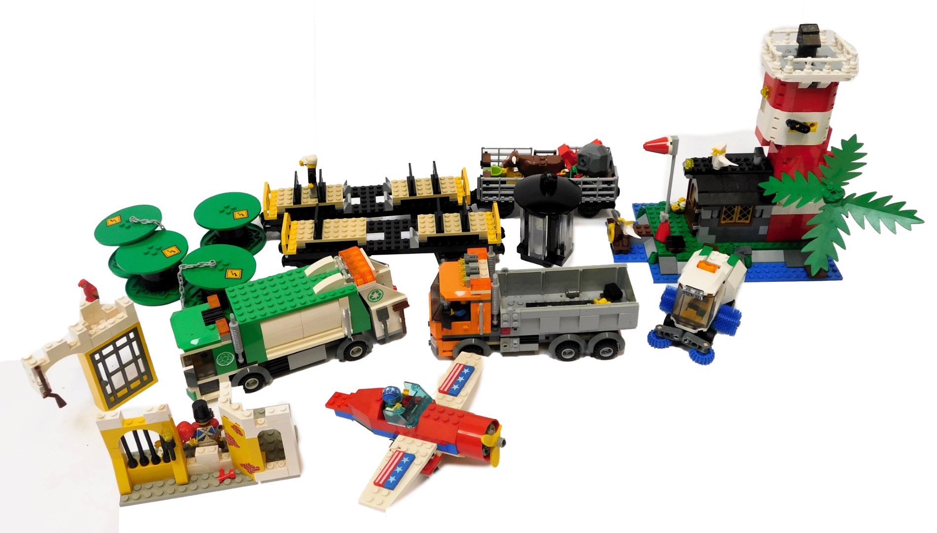 Various Lego Creator and other built Lego models, to include lighthouse, plane, train carriages,