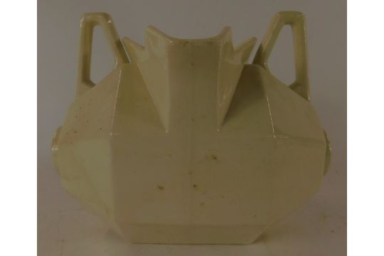 A 19thC cream glazed pottery twin-handled jug, of octagonal barrel form, 29cm wide. - Image 2 of 4