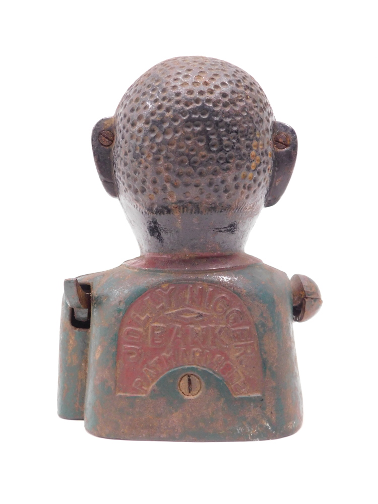 A painted ebonised money box, modelled in the form of a figure, stamped to reverse Jolly Bank, Pat. - Image 2 of 3