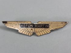 Aston Martin bonnet badge, white enamel wings with Aston Martin in the centre, J Pray Ltd on the