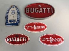 Bugatti cars, five car plaques from the 1980s, one oval cast alloy ,2 enamel centenary plaques in