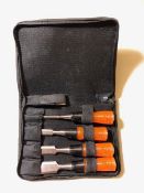 Four plastic handled cased chisels