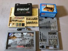 Collection of Woodworking Router parts and accessories in boxes