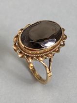 9ct Gold ring set with a smokey Quartz gemstone approx 13mm x 9mm and size 'L'