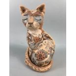 Studio Pottery, multi colour jigsaw pottery figure of a content cat with a fish, matt glaze finish