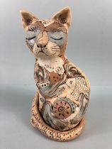 Studio Pottery, multi colour jigsaw pottery figure of a content cat with a fish, matt glaze finish