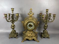 Antique Clock, Louis style elaborately decorated brass cased mantel clock with Roman numeral dial,