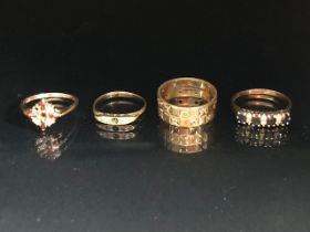 Four 9ct Gold rings set with various stones (total weight approx 10.9g) all as found