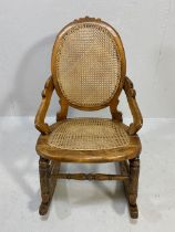 Antique Furniture, 19th century colonial plantation style light wood rocking chair, oval shaped back