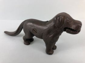 Antique cast Iron dog nut cracker, the tail leaver stamped Made in England along with an illegible