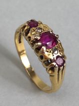 18ct Gold ring set with red/pink gemstones size approx 'L' & 3.7g